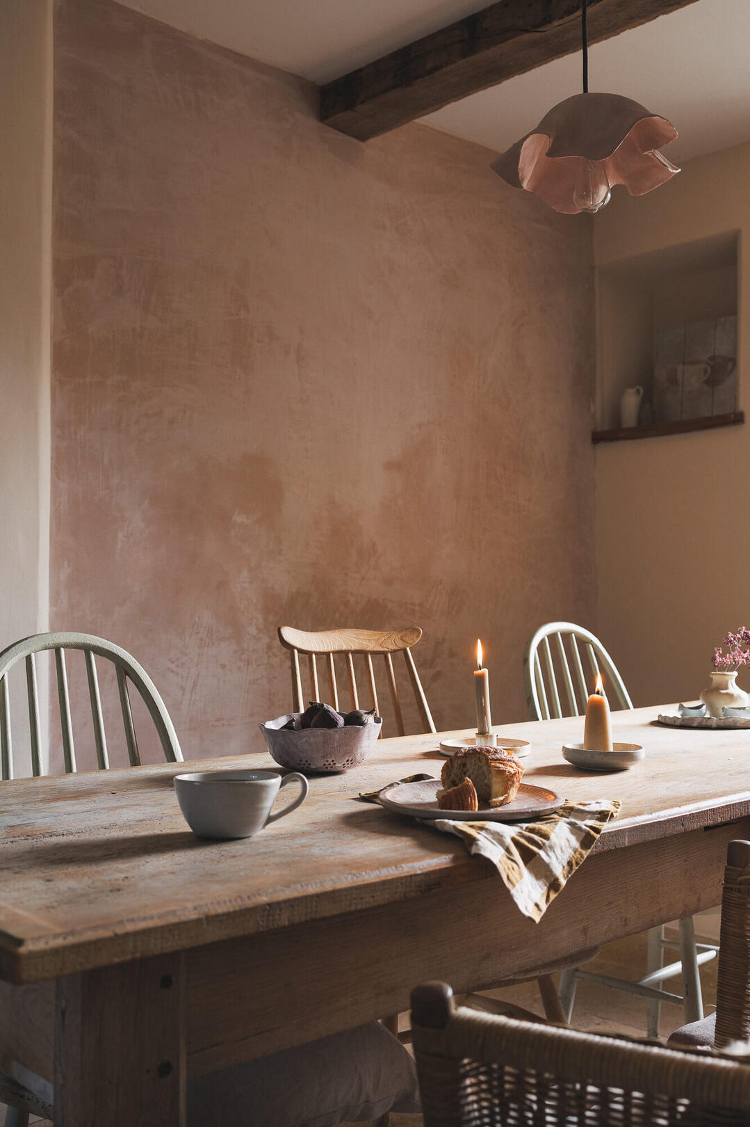 Atmospheric kitchen interior with textured plaster walls and natural light