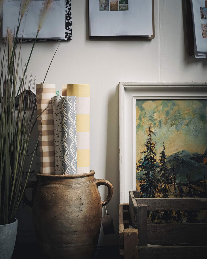 Collected artwork and objects in a characterful interior
